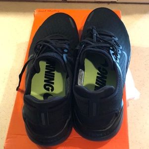 Brand new Nike Running shoes in solid black